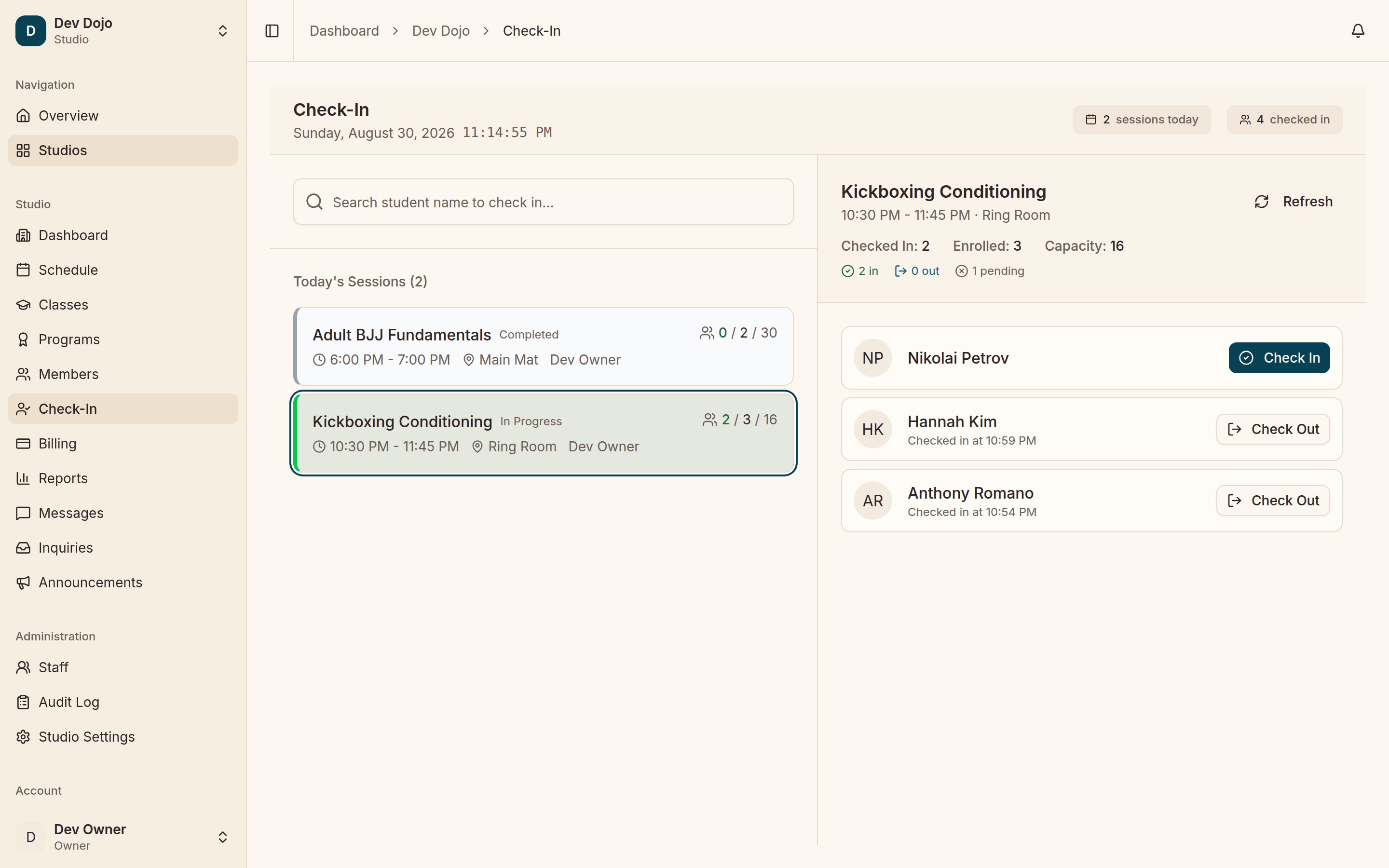 The Check-In screen: today’s two sessions with live checked-in counts, and the in-progress Kickboxing Conditioning roster with Check In and Check Out buttons